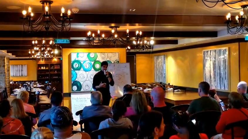 Bassam Mallick leading a seminar on fitness and nutrition topics
