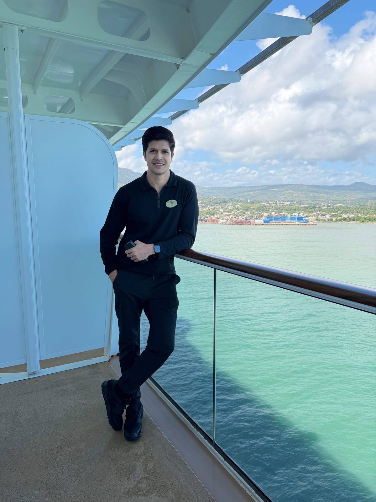 Bassam Mallick — On deck overlooking a tropical port